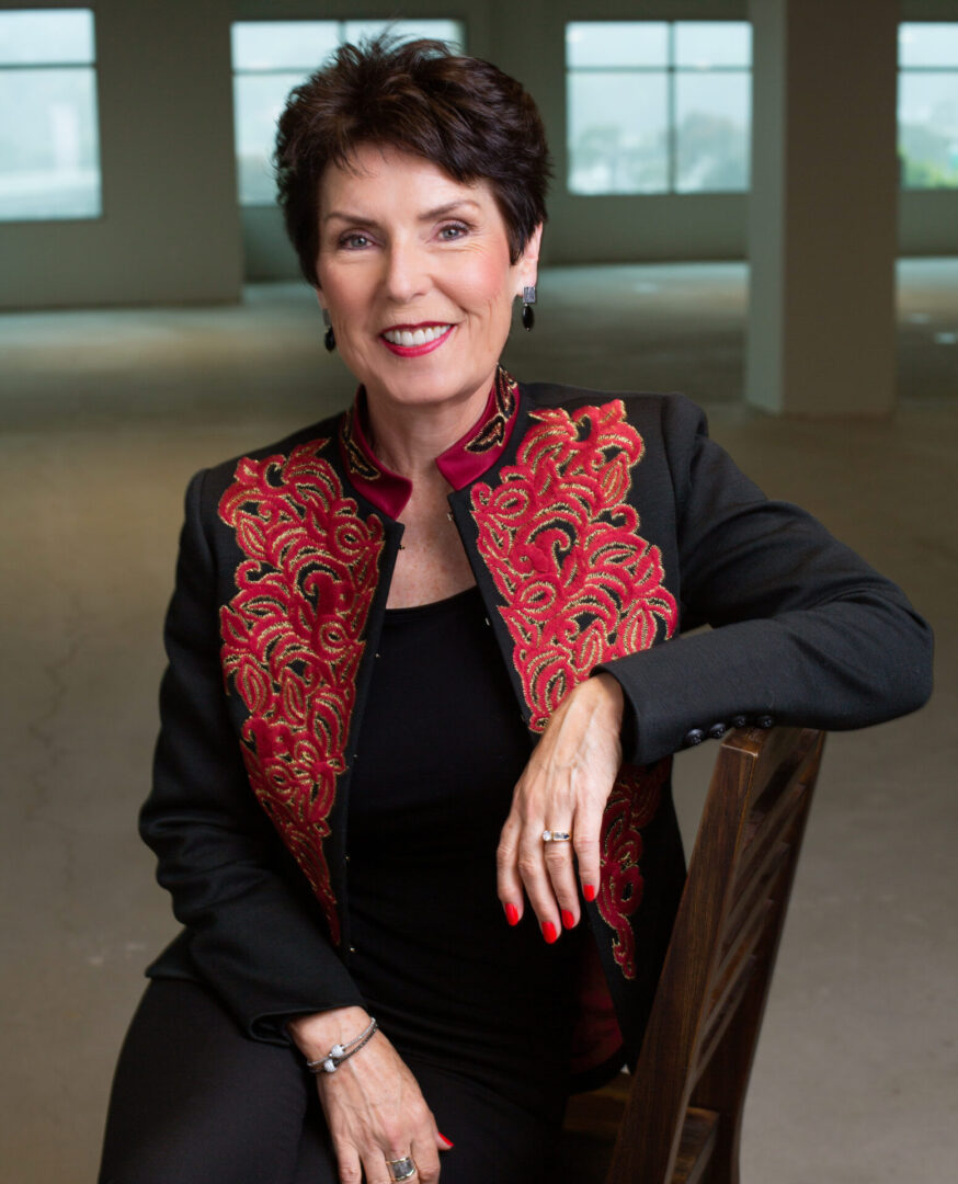 Colored image of woman sitting on a chair